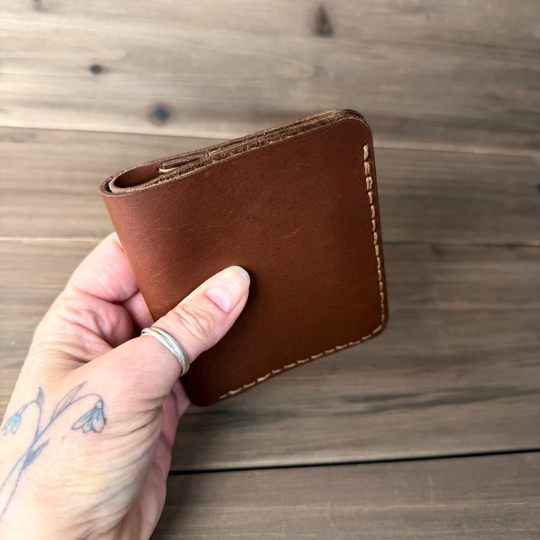 Closed brown full grain leather bifold wallet handmade in Canada