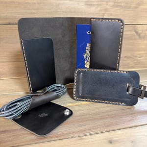 Handmade leather travel set with passport holder, luggage tag and cord holders